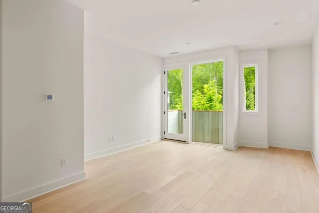 a view of a room with a large window