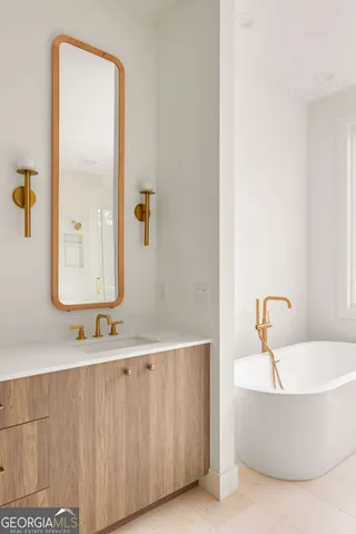 a bathroom with a bathtub and shower