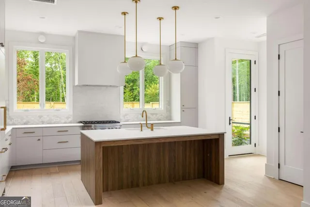 a kitchen with a sink and window