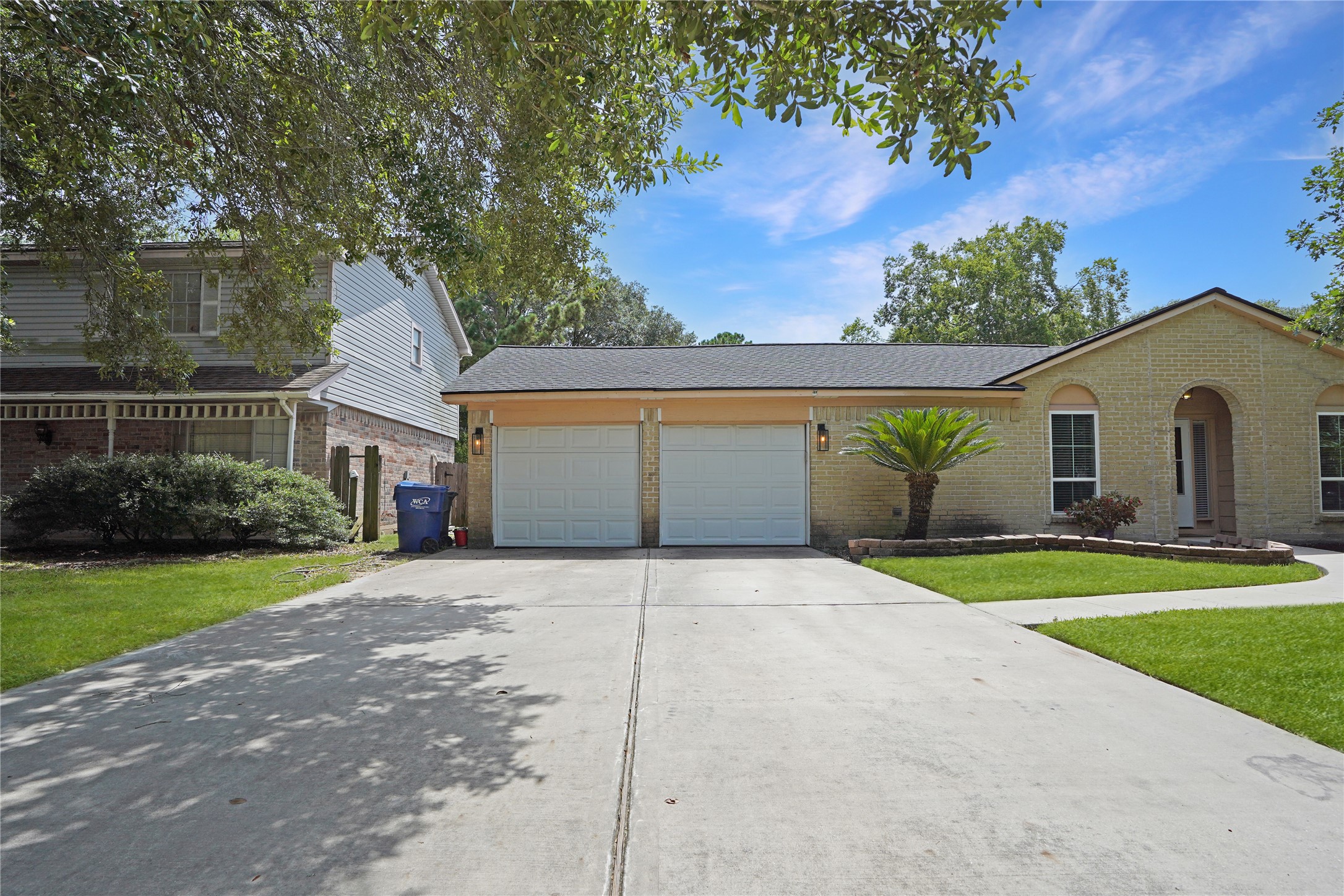 17119 Mellow Ridge Drive Spring, TX 77379 - Photo 32 of 32 This inviting home features a well-maintained exterior with a double garage, a neat lawn, and a charming entryway. The light brick facade and arched doorway add character, while surrounding trees offer a touch of nature.
