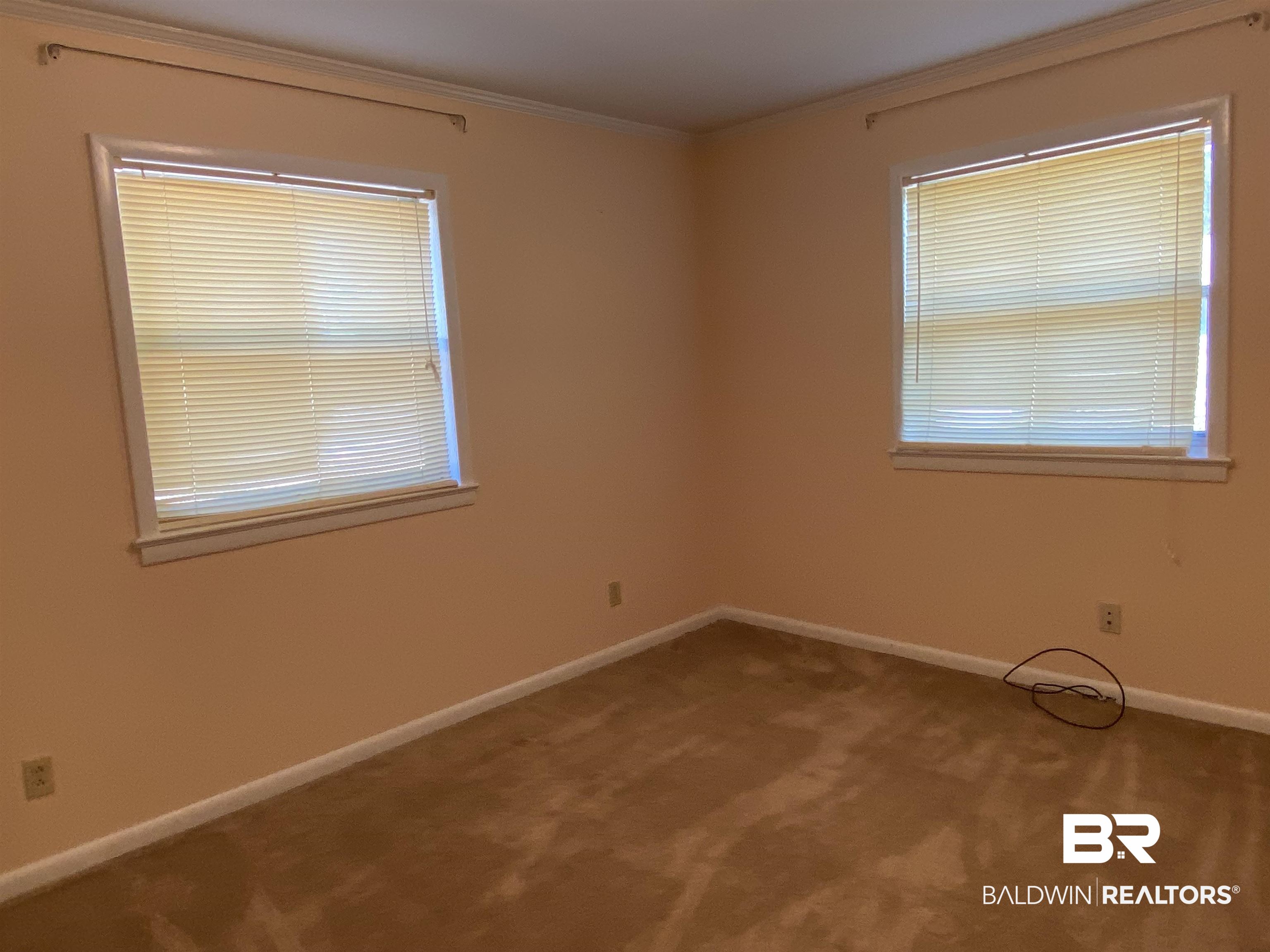 106 Terry Drive Brewton, AL 36426 - Photo 15 of 25 Carpeted bedroom featuring baseboards and crown molding