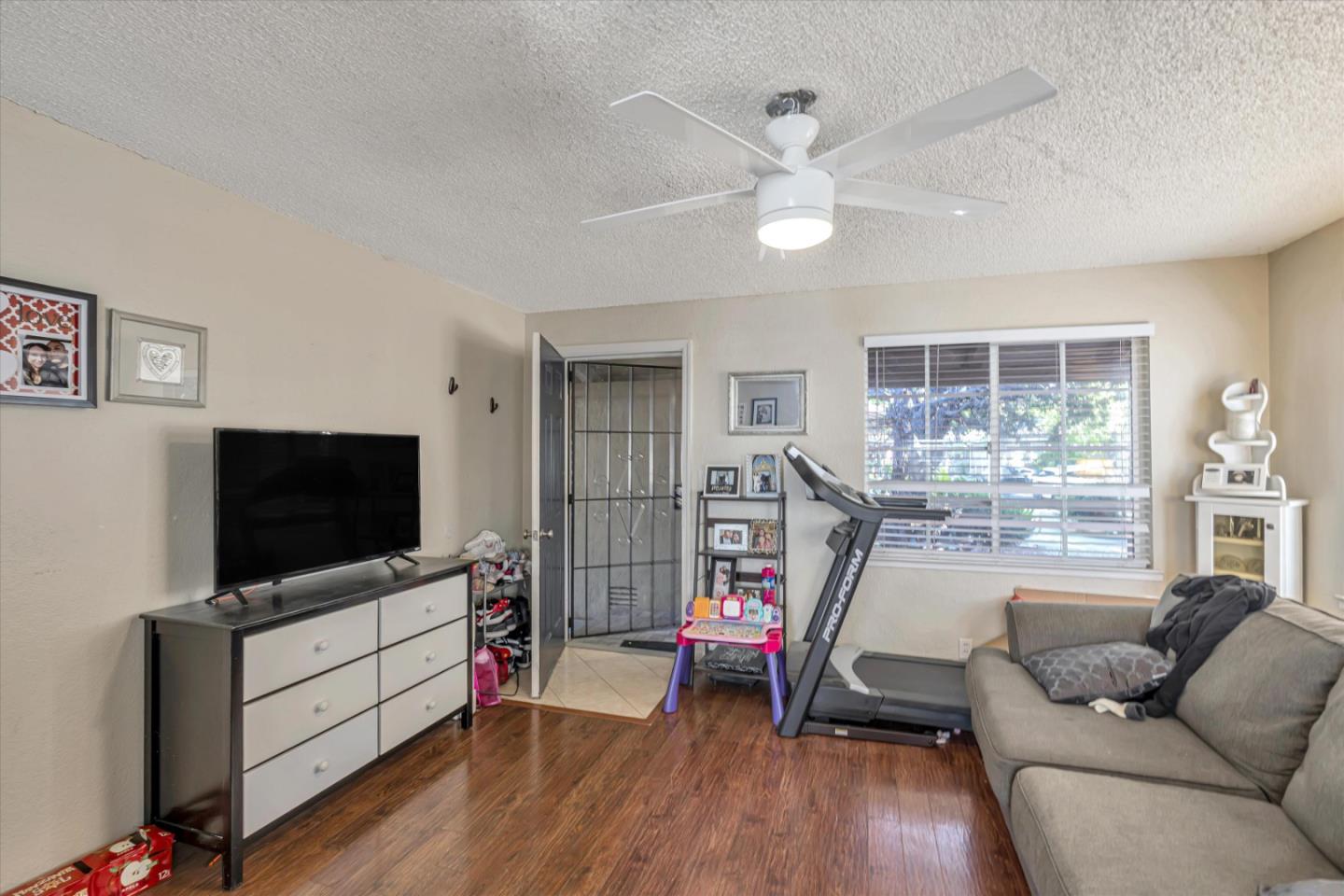 1019 Gemini Court Modesto, CA 95355 - Photo 2 of 10 a living room with furniture and a flat screen tv