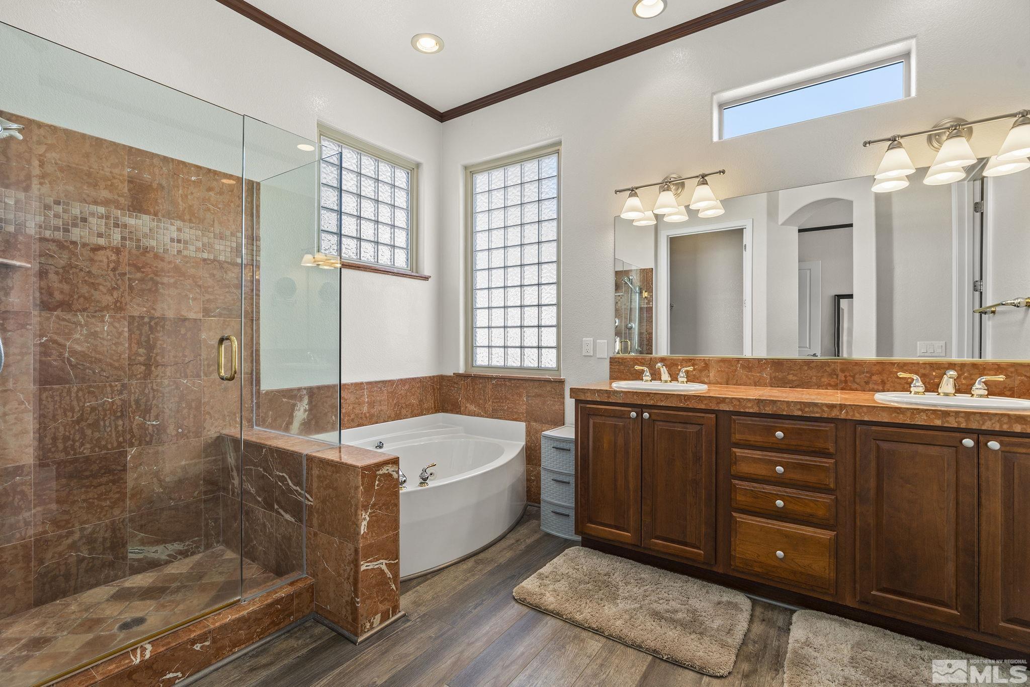 9900 Wilbur May Parkway, Unit 2404 Reno, NV 89521 - Photo 15 of 36 a spacious bathroom with a tub sink shower and mirror
