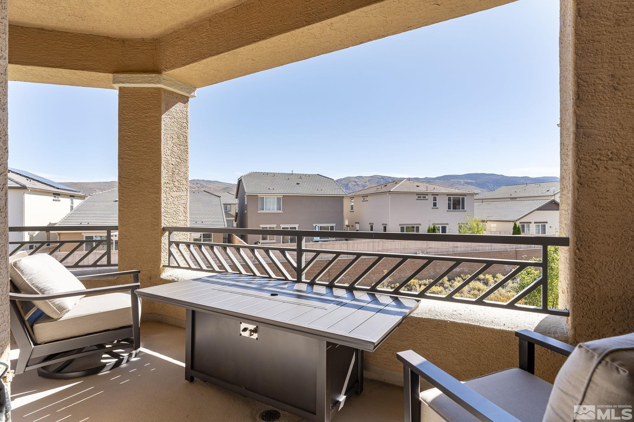 9900 Wilbur May Parkway, Unit 2404 Reno, NV 89521 - Photo 21 of 36 a view of a chairs and table in the balcony