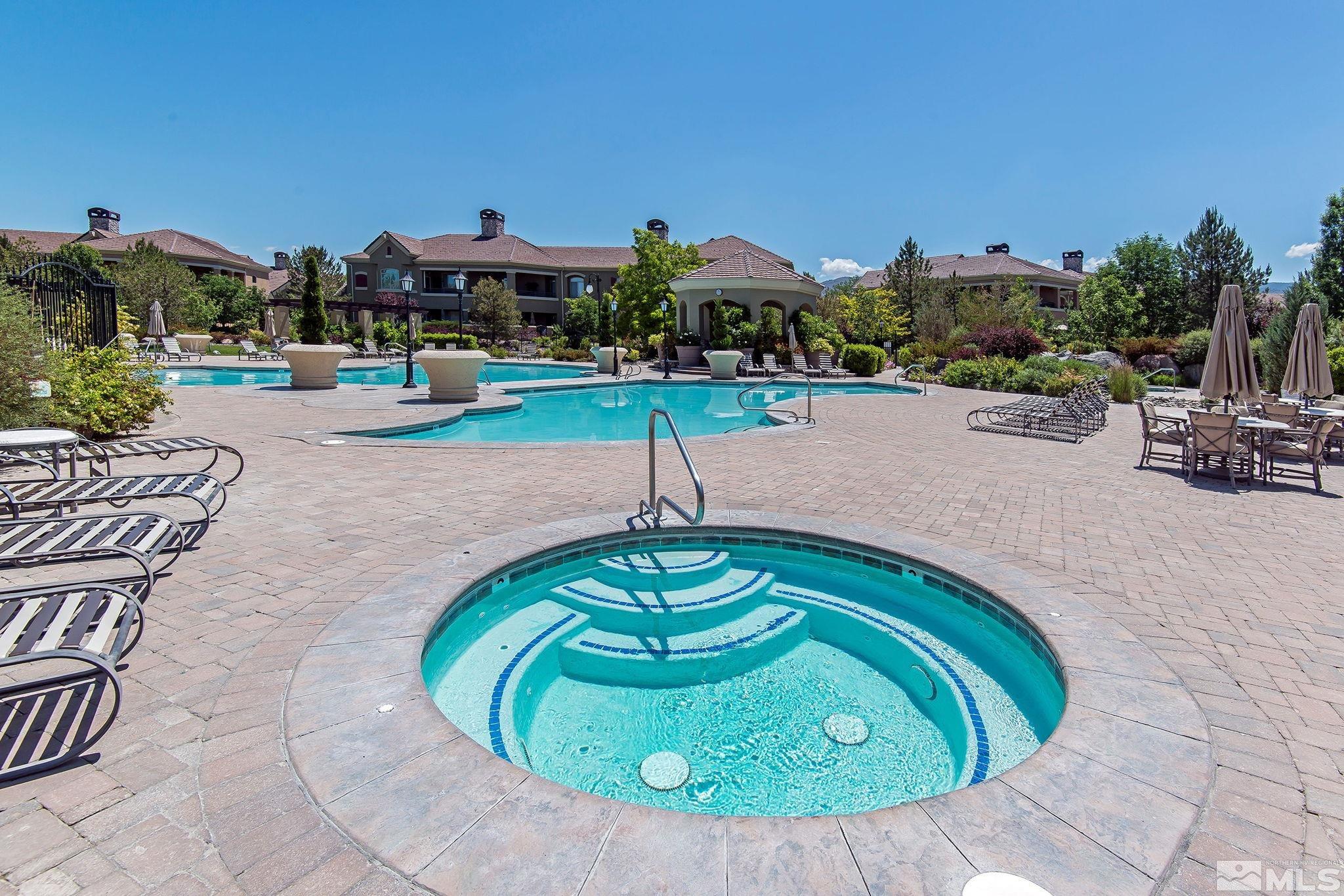 9900 Wilbur May Parkway, Unit 2404 Reno, NV 89521 - Photo 27 of 36 a view of a swimming pool with a patio