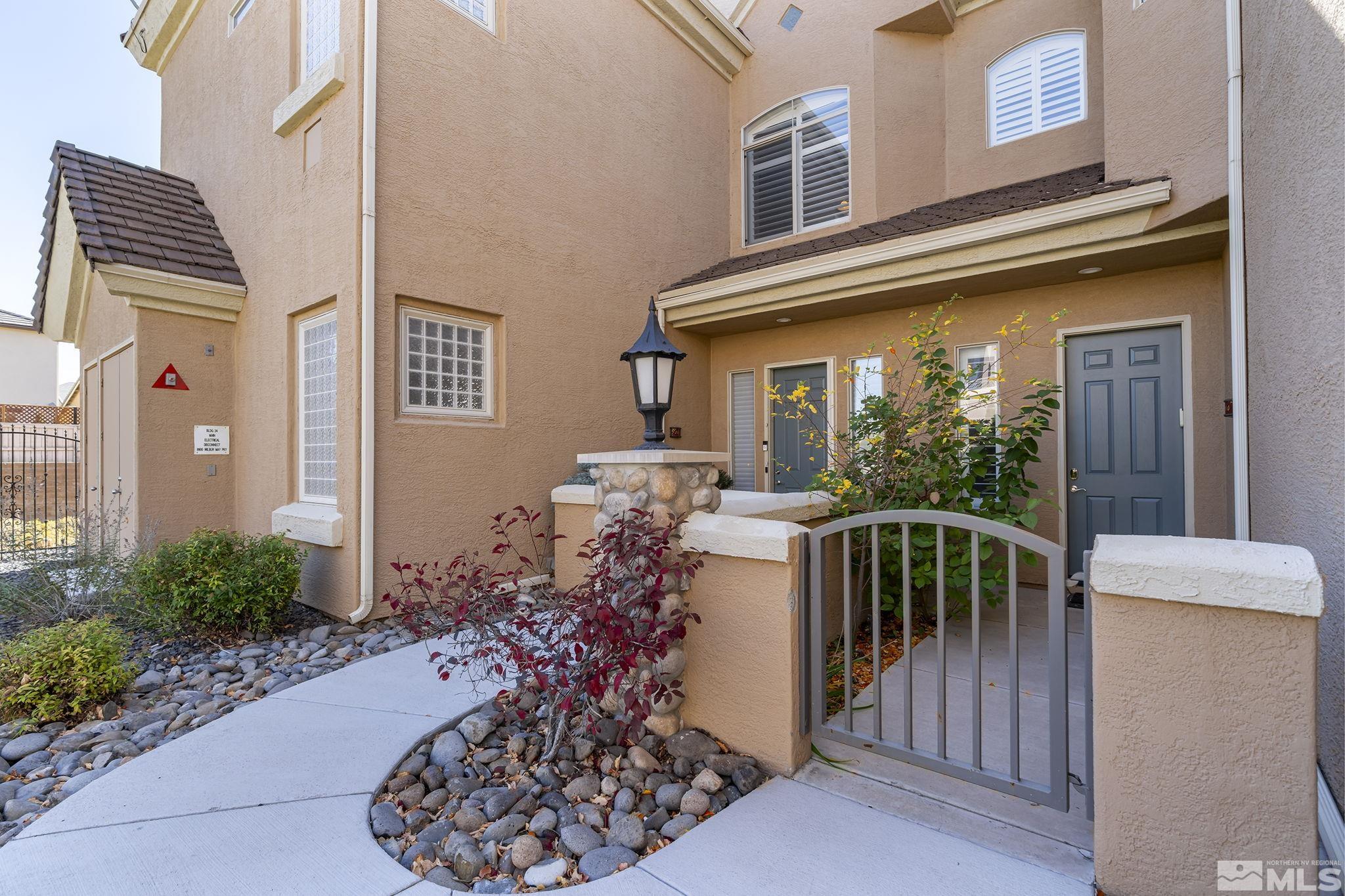 9900 Wilbur May Parkway, Unit 2404 Reno, NV 89521 - Photo 3 of 36 a view of a house with backyard and sitting area