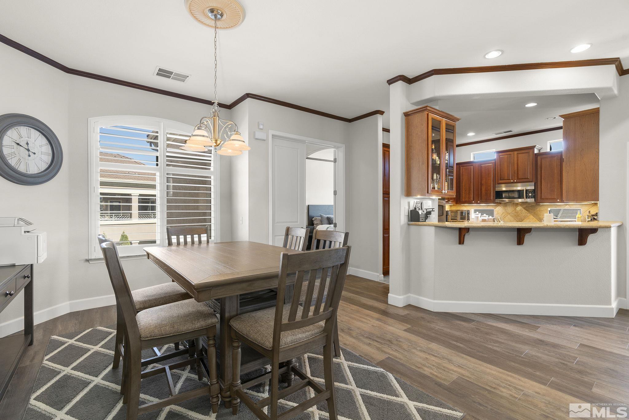 9900 Wilbur May Parkway, Unit 2404 Reno, NV 89521 - Photo 5 of 36 a dining room with furniture and window