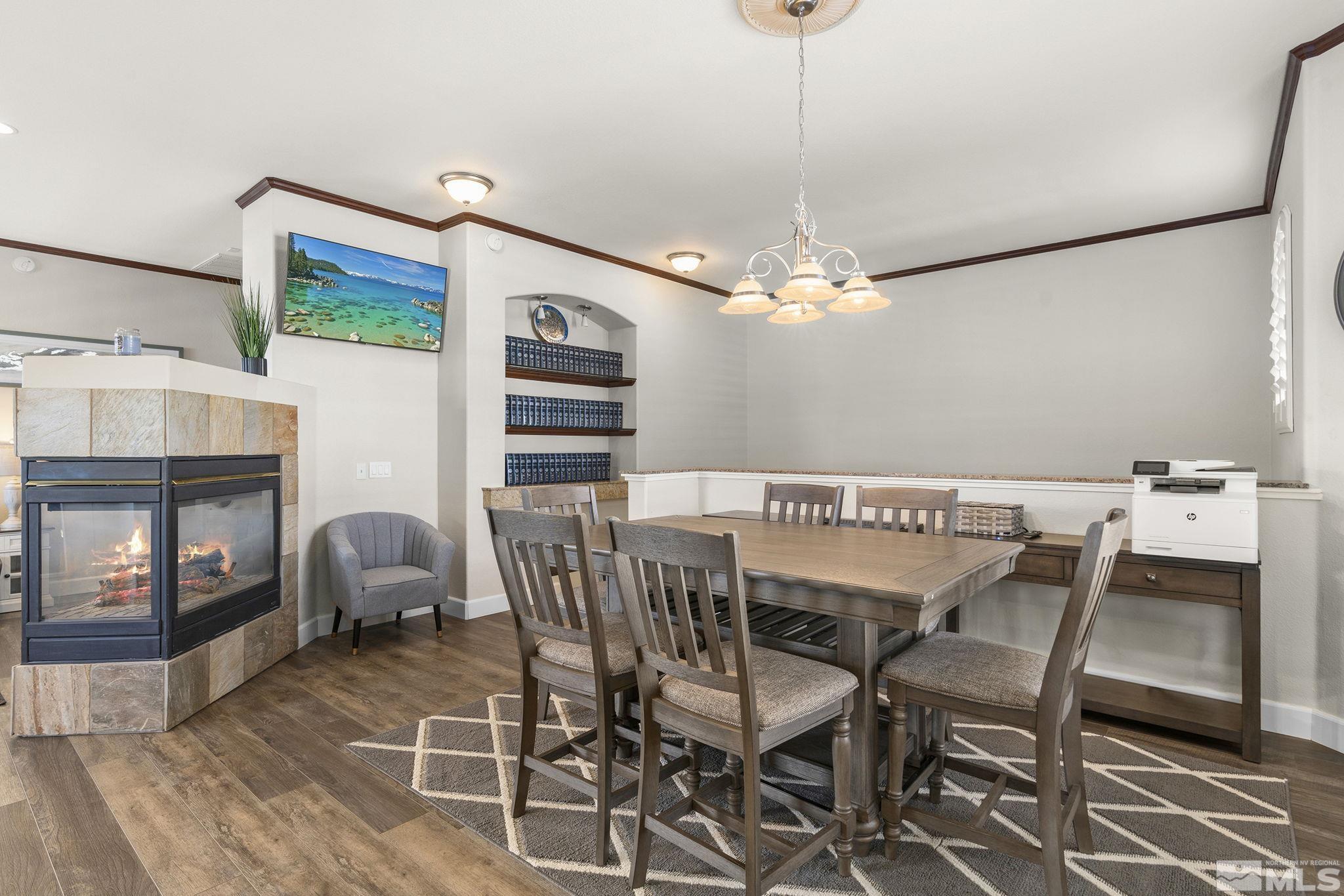 9900 Wilbur May Parkway, Unit 2404 Reno, NV 89521 - Photo 6 of 36 a view of a dining room with furniture and a chandelier
