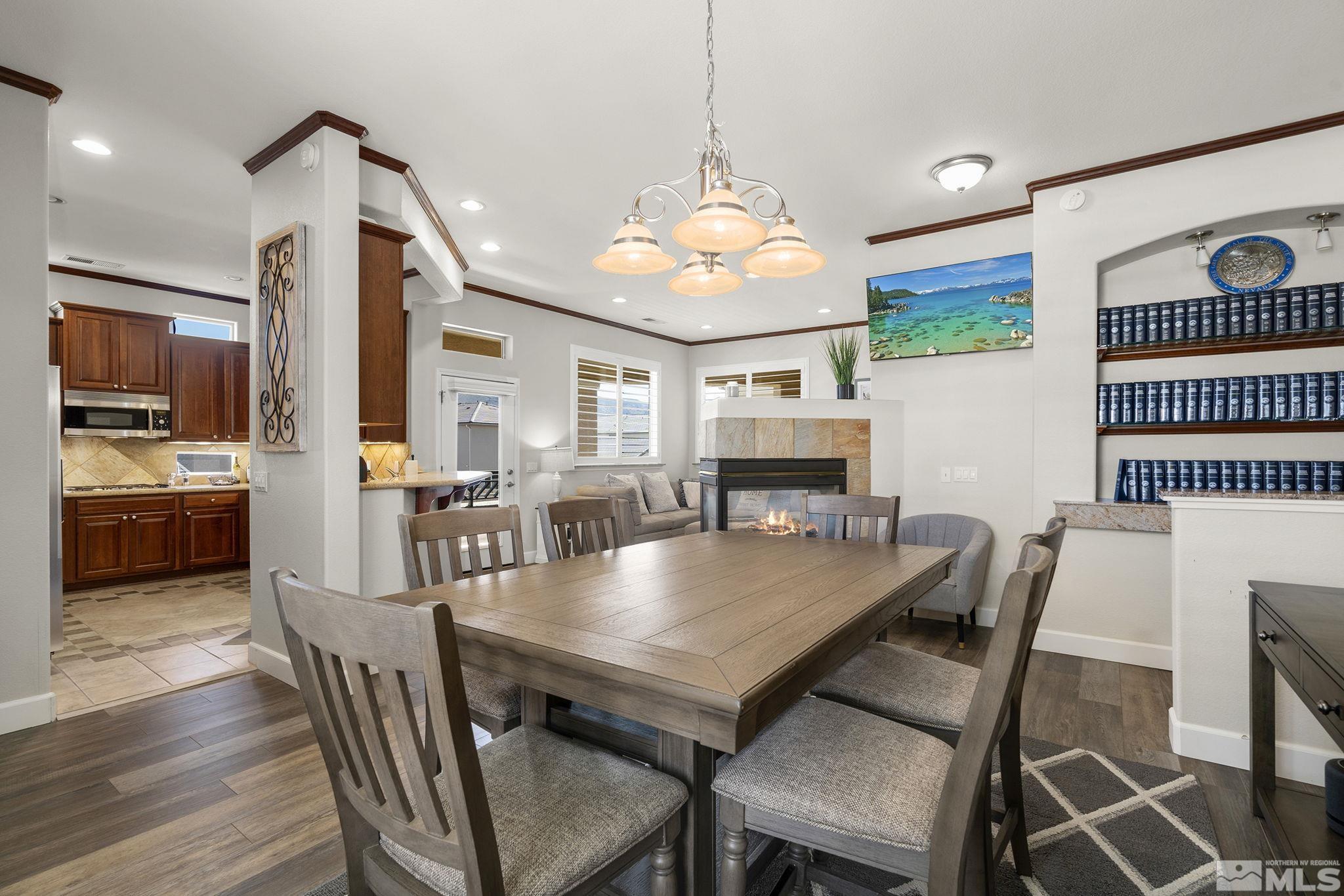 9900 Wilbur May Parkway, Unit 2404 Reno, NV 89521 - Photo 7 of 36 a view of a dining room with furniture and wooden floor