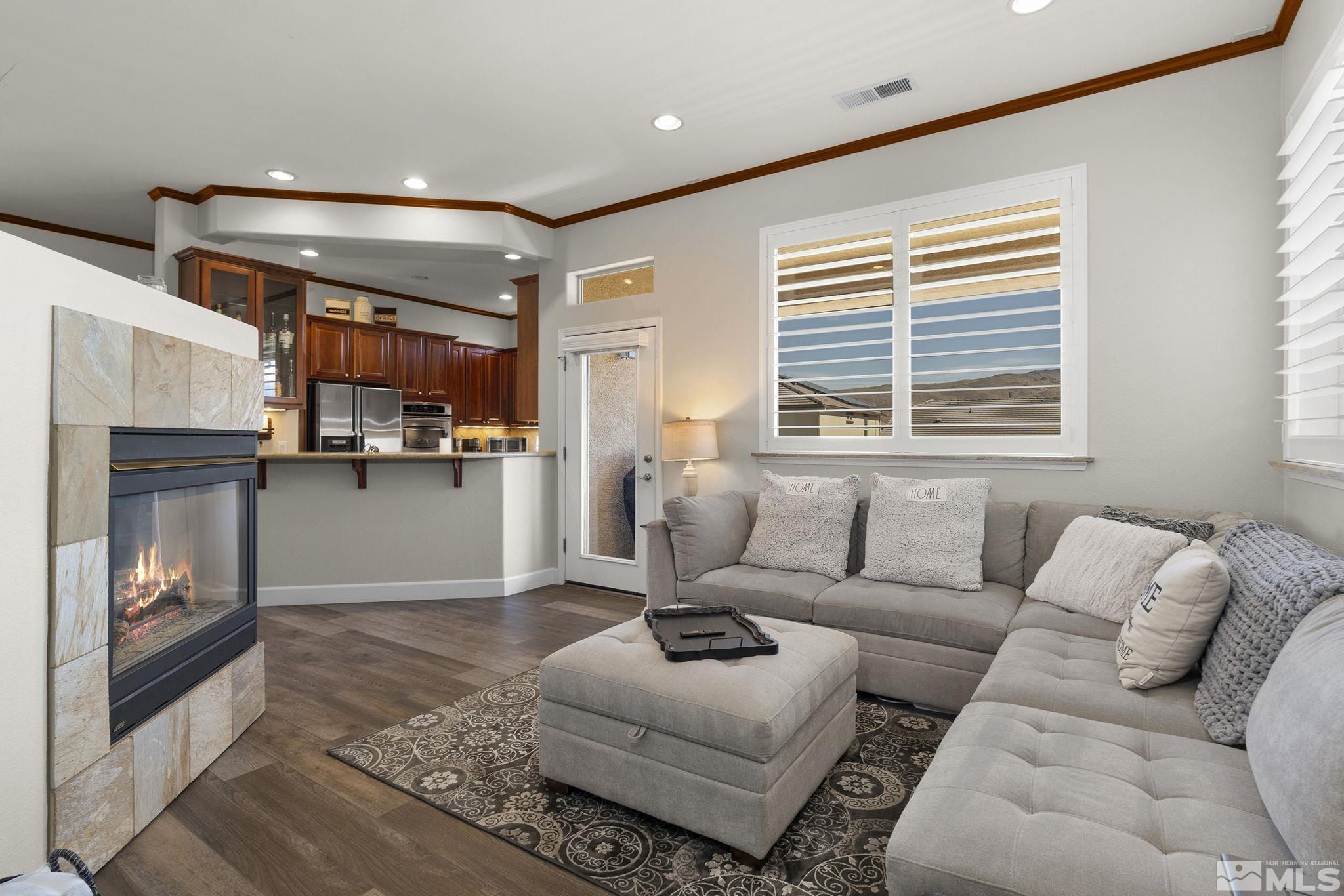 9900 Wilbur May Parkway, Unit 2404 Reno, NV 89521 - Photo 10 of 36 a living room with furniture and a window