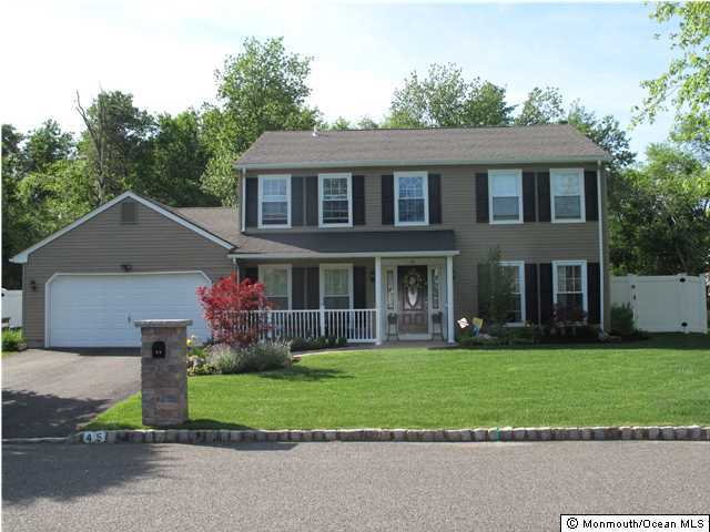 45 Sweet Gum Road Howell, NJ 07731 - Photo 1 of 25 a front view of a house with a yard and trees