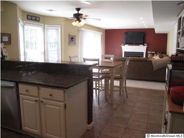 45 Sweet Gum Road Howell, NJ 07731 - Photo 14 of 25 a living room with furniture a large window and a chandelier