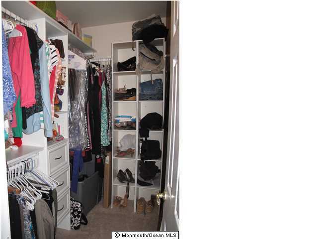 45 Sweet Gum Road Howell, NJ 07731 - Photo 16 of 25 a view of walk in closet with clothes and shoes