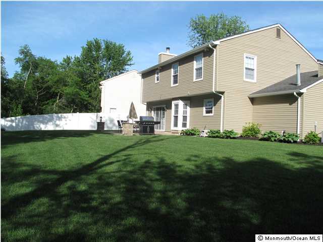45 Sweet Gum Road Howell, NJ 07731 - Photo 24 of 25 a front view of house with a garden