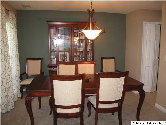 45 Sweet Gum Road Howell, NJ 07731 - Photo 5 of 25 a view of a dining room with furniture and chandelier