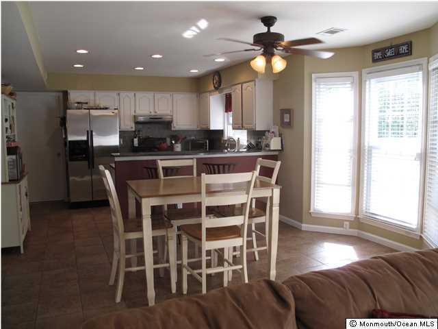 45 Sweet Gum Road Howell, NJ 07731 - Photo 8 of 25 a view of a dining room with furniture and a chandelier