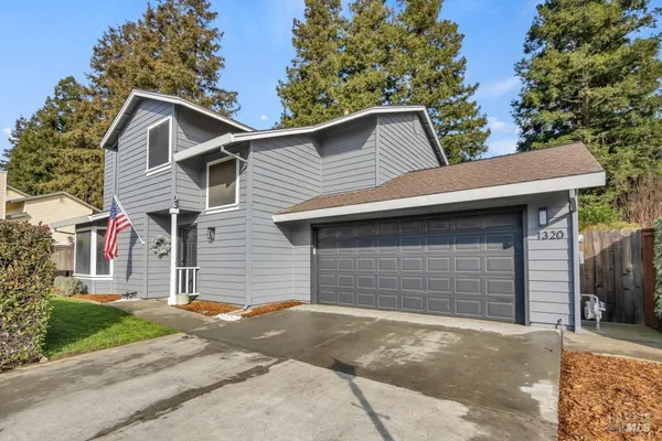 a front view of a house with a garage