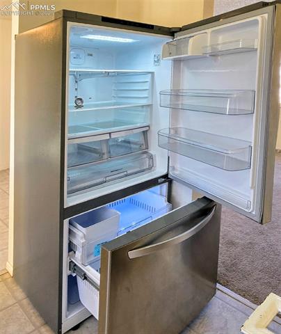 6313 Chippewa Road Colorado Springs, CO 80915 - Photo 23 of 36 Room details with stainless steel fridge