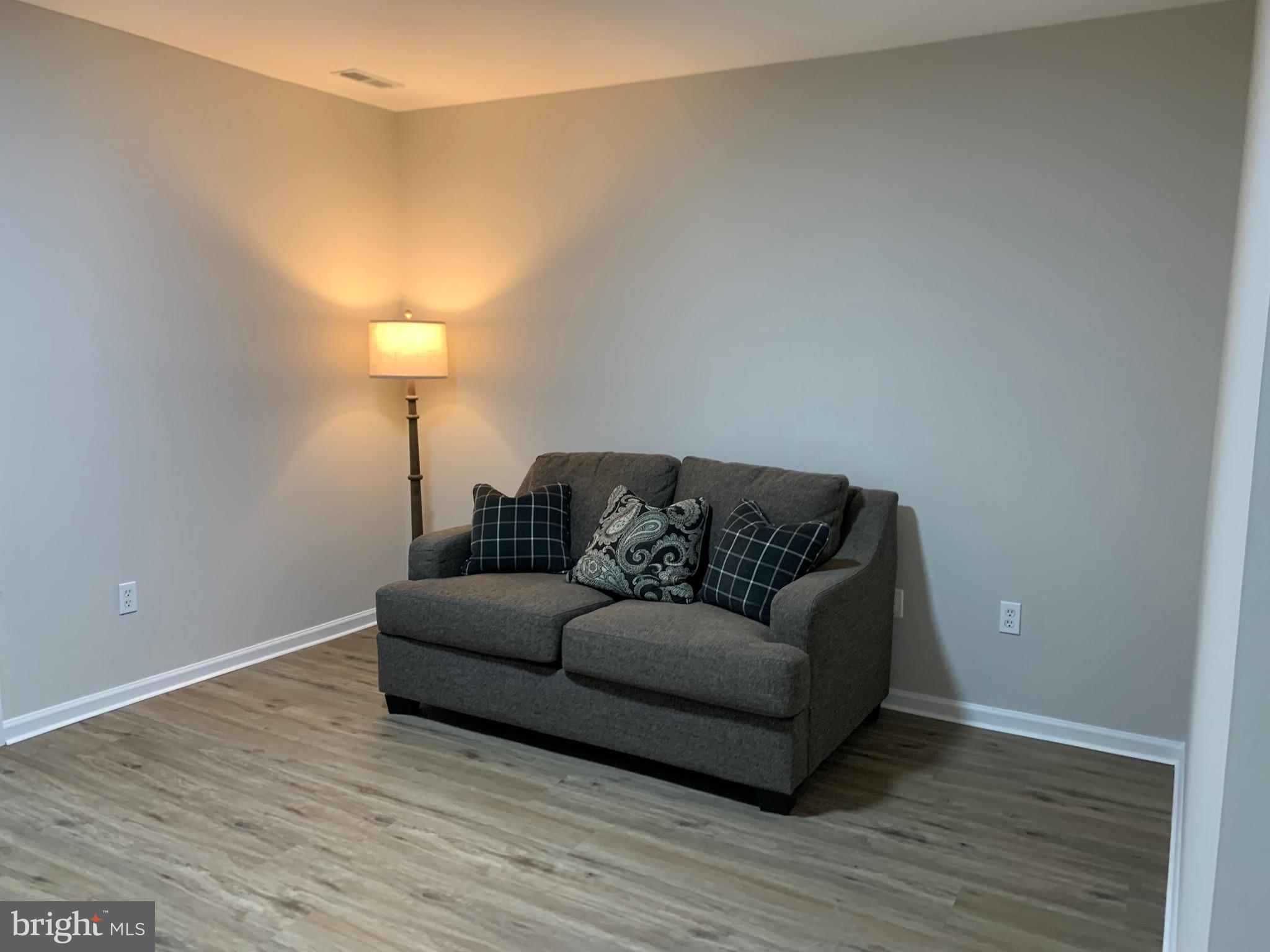 114 Sentry Ridge Smithsburg, MD 21783 - Photo 51 of 60 a living room with furniture and a lamp