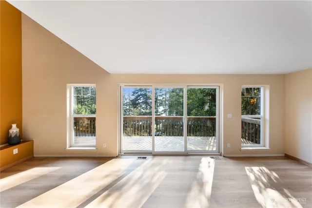 a view of a balcony with wooden floor
