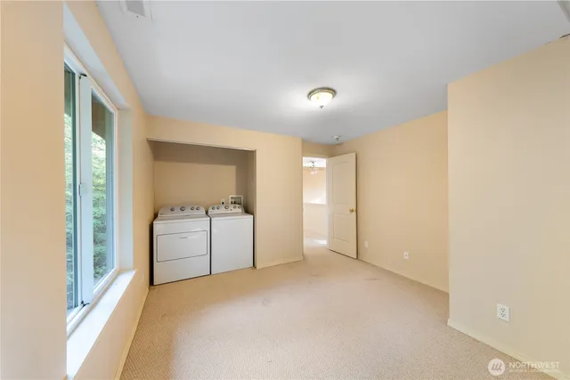 a view of a dry yard with wooden fence