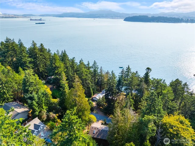 a view of a lake with beach and outdoor space