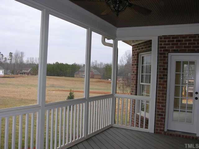 3313 Cotton Road Raleigh, NC 27601 - Photo 6 of 10 Screened porch with trex flooring, ceiling fan, and stairs to patio for outdoor entertaining. Other