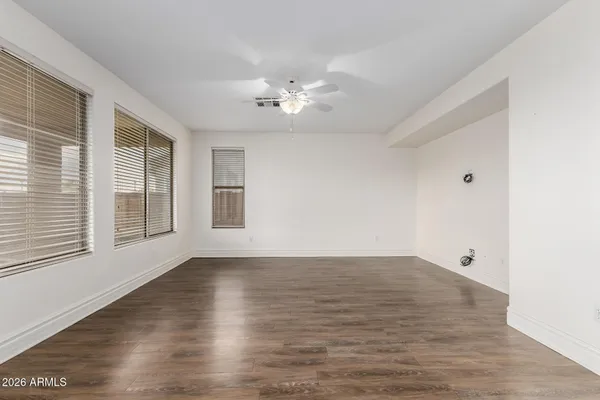 a kitchen with kitchen island a large counter top space a sink stainless steel appliances and cabinets