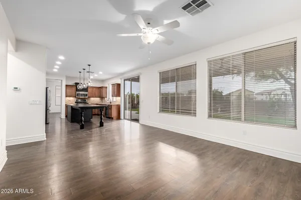a kitchen with granite countertop cabinets stainless steel appliances and a window