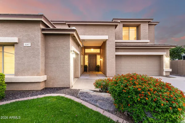 a front view of a house with a yard and porch