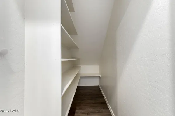 an empty room with a ceiling fan