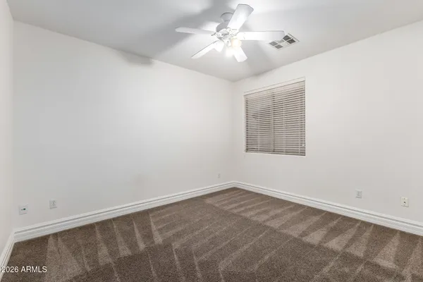 an aerial view of a house with a garden and swimming pool
