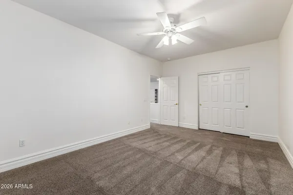 an aerial view of a house with a yard and outdoor seating