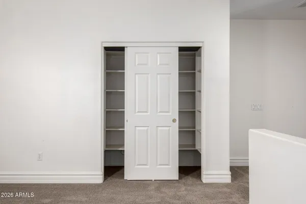 an aerial view of a house with a table and chairs