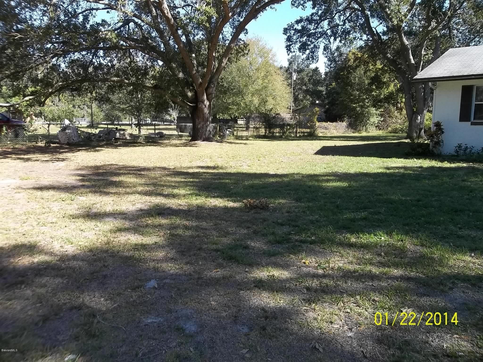 4041 Mullens Road Mims, FL 32754 - Photo 25 of 27 left side of front yard