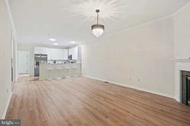 a view of a kitchen with a sink and cabinets