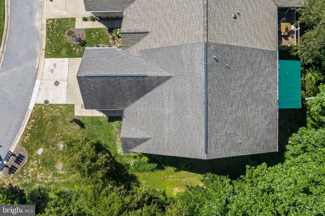 an aerial view of a house having yard