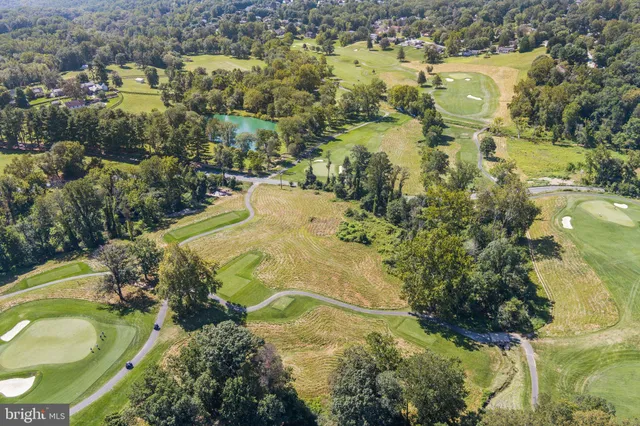 an aerial view of residential house with swimming pool
