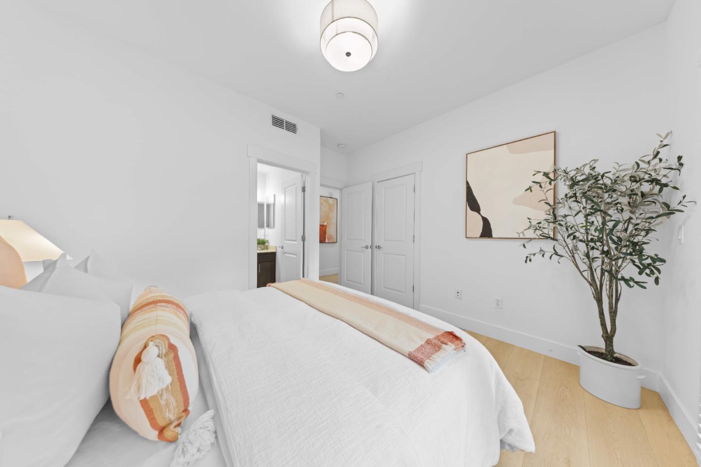 856 Sycamore Loop Mountain View, CA 94043 - Photo 12 of 27 a bedroom with a bed and a chandelier