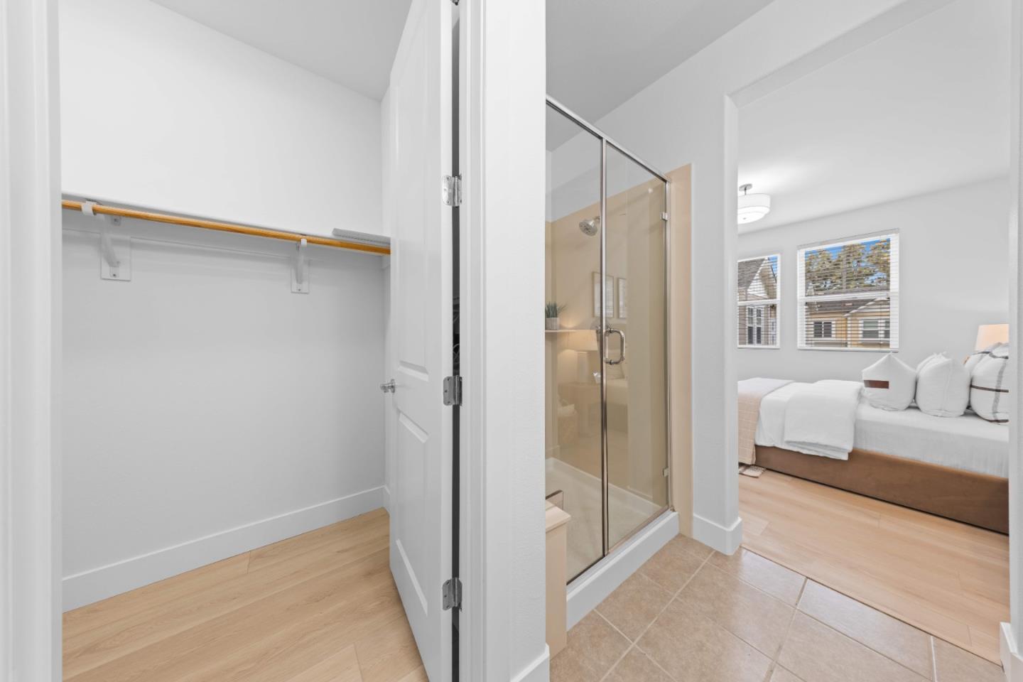 856 Sycamore Loop Mountain View, CA 94043 - Photo 18 of 27 a spacious bedroom with a bed and a walk in closet