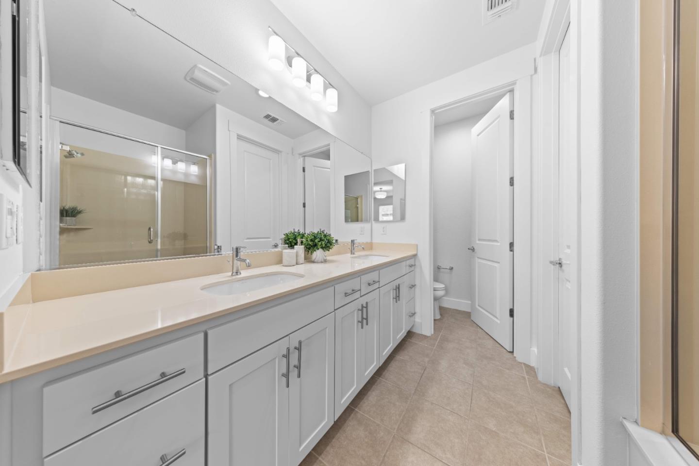 856 Sycamore Loop Mountain View, CA 94043 - Photo 19 of 27 a spacious bathroom with a double vanity sink and a mirror