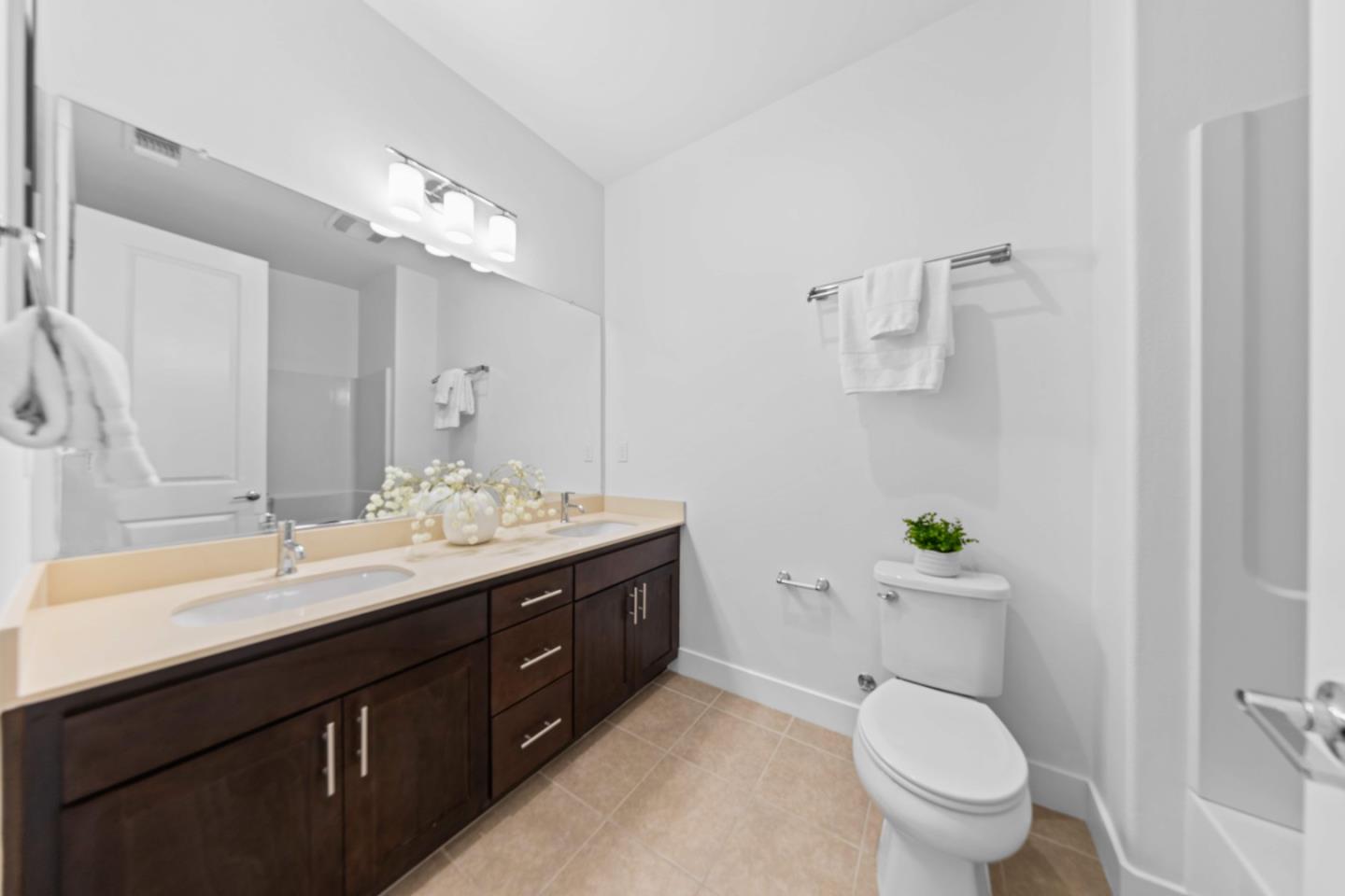 856 Sycamore Loop Mountain View, CA 94043 - Photo 20 of 27 a bathroom with a granite countertop toilet sink and mirror