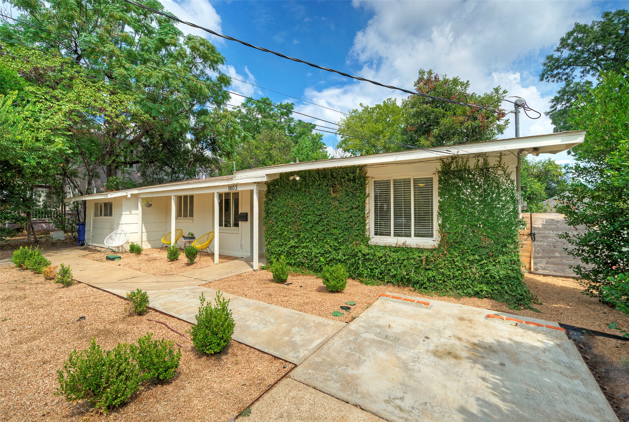 1803 Pearl Street Austin, TX 78701 - Photo 31 of 33 a front view of a house with garden and patio