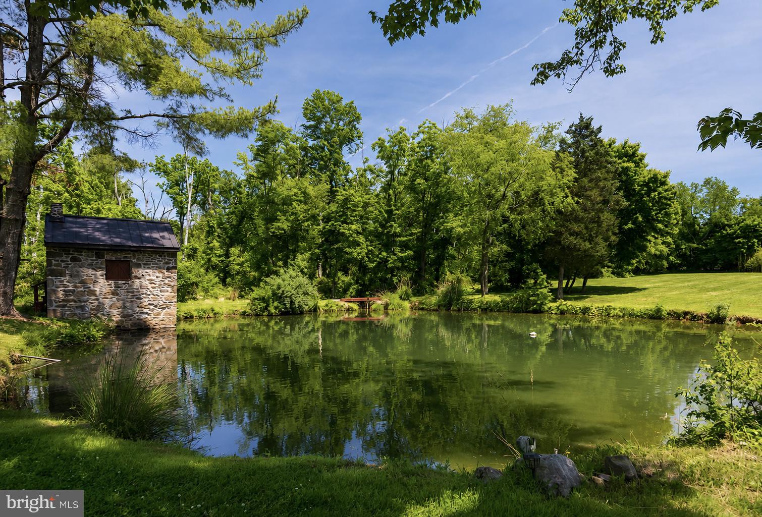 108 Sheeder Road Phoenixville, PA 19460 - Photo 34 of 42 a view of a lake with a building in the background