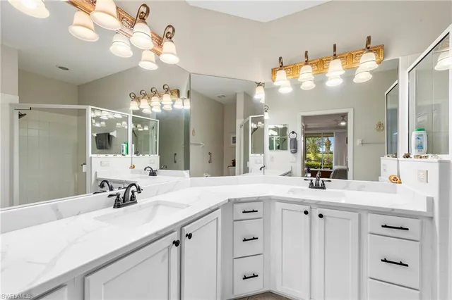 a bathroom with a sink vanity and a mirror