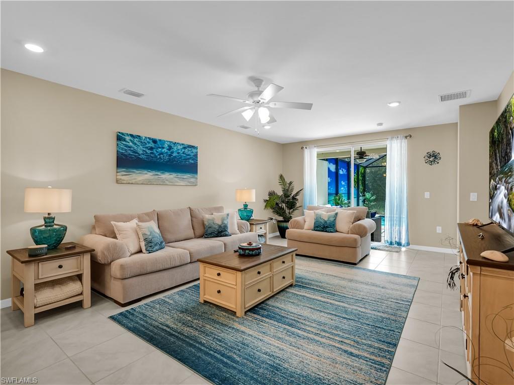 14695 Edgewater Circle Naples, FL 34114 - Photo 14 of 39 a living room with furniture and a couch