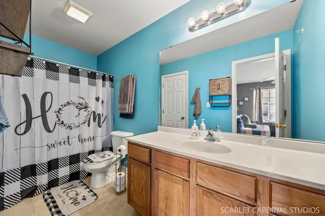 a bathroom with 2 sink and a mirror