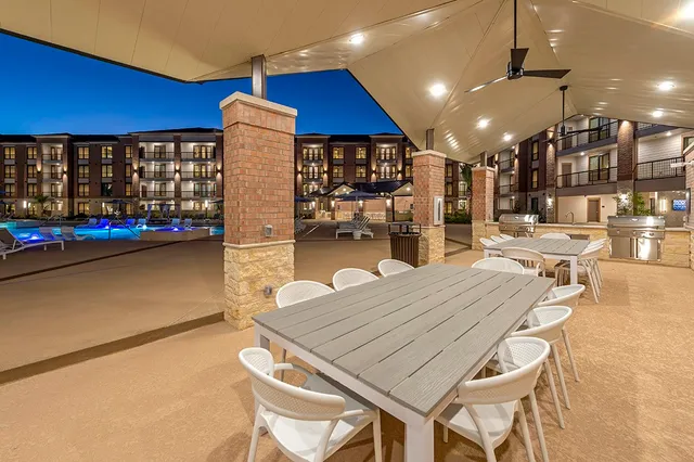 a dinning table and chairs in the patio