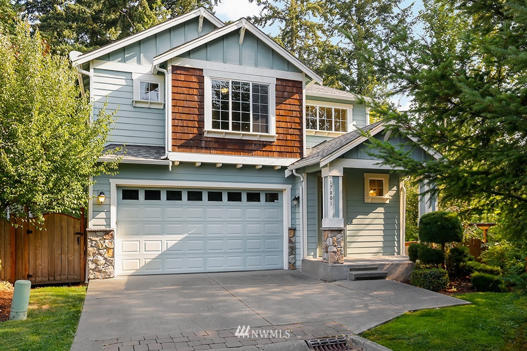17801 20th Avenue Southeast Bothell, WA 98012 - Photo 1 of 25 a front view of a house with a yard and garage