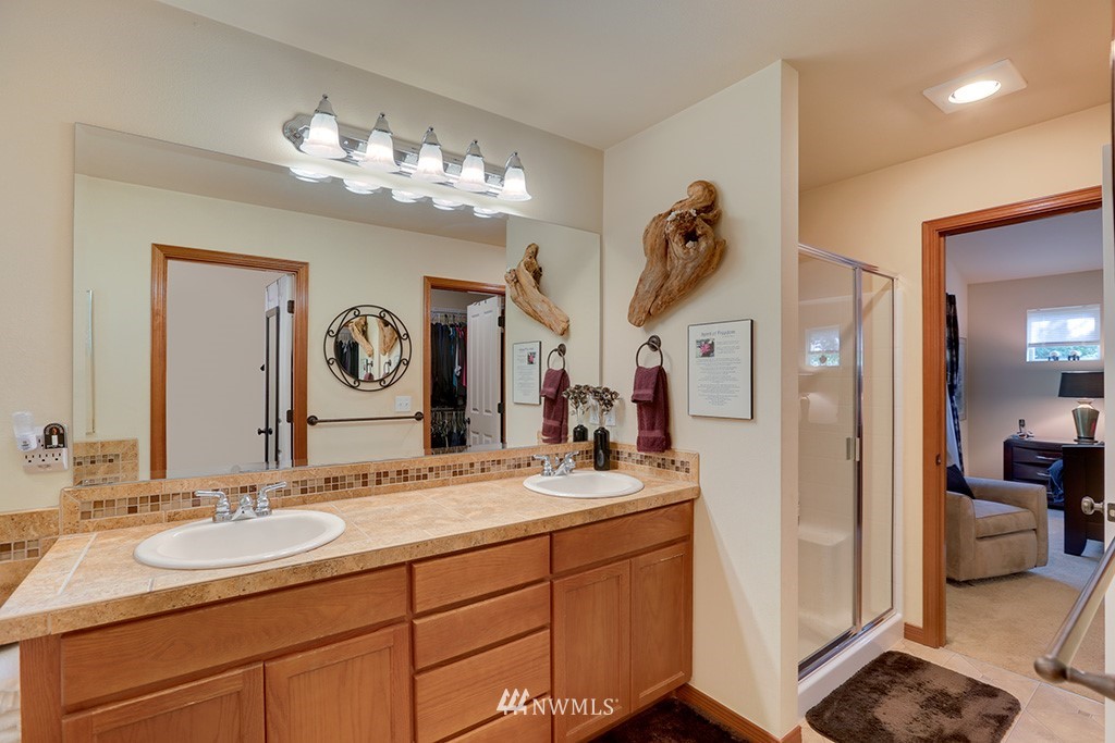 17801 20th Avenue Southeast Bothell, WA 98012 - Photo 13 of 25 a bathroom with a sink double vanity and a mirror
